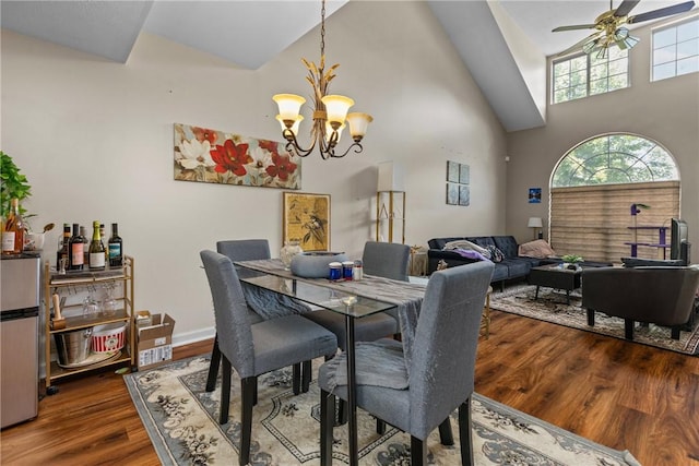 302 Malcolm Ct, Monroeville, PA 15146 - dining space featuring wood finished floors, a ceiling fan, high vaulted ceiling, and a chandelier
