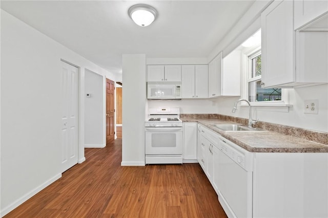 718 Twin Oak Dr, Penn Hills, PA 15235 - kitchen featuring white appliances, dark wood finished floors, white cabinets, and light countertops