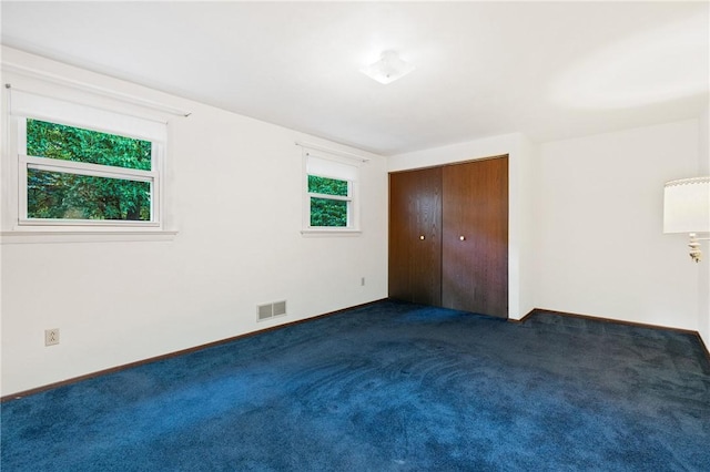 718 Twin Oak Dr, Penn Hills, PA 15235 - unfurnished bedroom with dark colored carpet and a closet