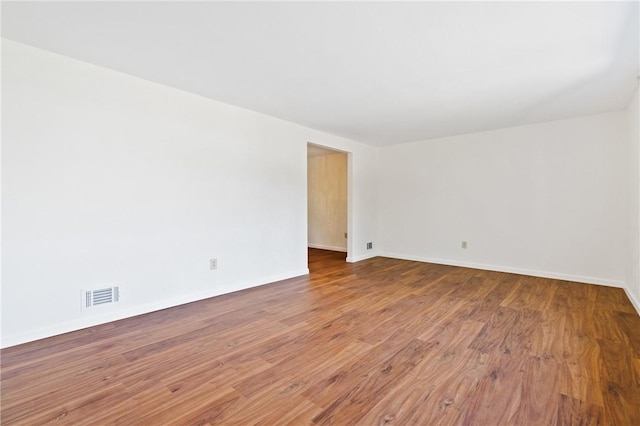 718 Twin Oak Dr, Penn Hills, PA 15235 - spare room featuring wood finished floors and baseboards
