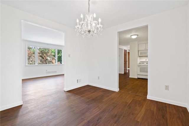 718 Twin Oak Dr, Penn Hills, PA 15235 - spare room with a chandelier and dark wood-style flooring