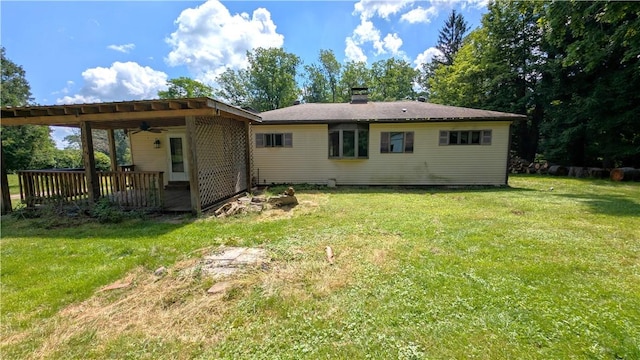 89 Rankin Rd, Wharton Twp, PA 15437 - back of property with ceiling fan, a yard, a chimney, and a deck