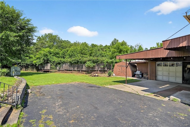 2509 Thomas St, Hempfield Twp, PA 15634 - view of yard featuring a storage shed and driveway