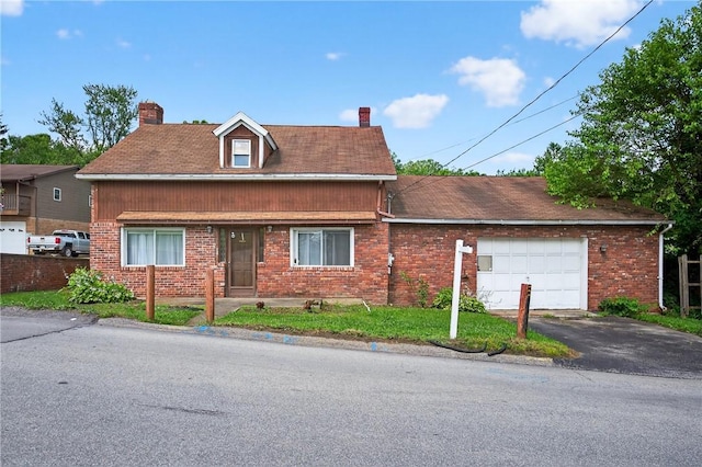 2509 Thomas St, Hempfield Twp, PA 15634 - view of front of home featuring a chimney, a garage, and brick siding