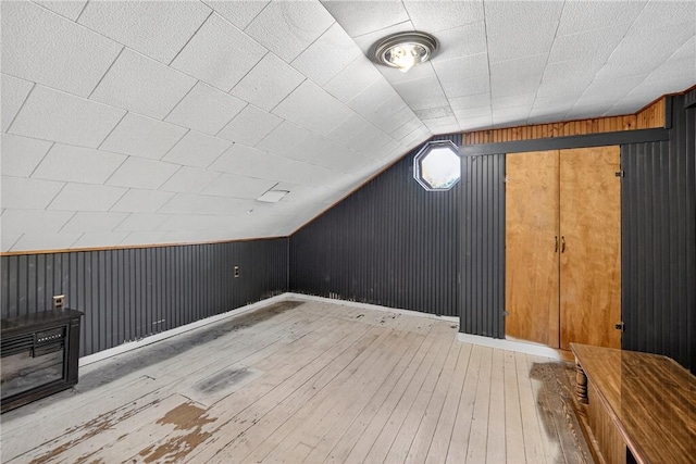 2509 Thomas St, Hempfield Twp, PA 15634 - additional living space featuring wood-type flooring, wooden walls, and vaulted ceiling