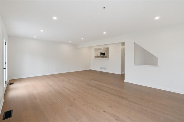 1278 Meadowbrook Dr, North Strabane, PA 15317 - unfurnished living room with recessed lighting and light wood-style flooring