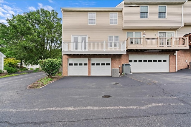 1278 Meadowbrook Dr, North Strabane, PA 15317 - view of front of property featuring asphalt driveway, an attached garage, and brick siding