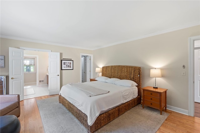 1413 Oak St, Oakmont, PA 15139 - bedroom featuring ornamental molding, light wood-style flooring, a closet, and a walk in closet