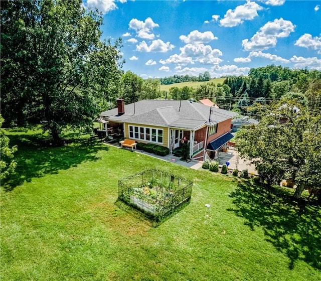 3015 Graham Ave, Windber, PA 15963 - view of front facade featuring a chimney and a front yard
