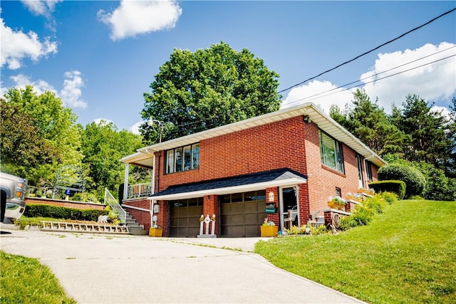 3015 Graham Ave, Windber, PA 15963 - view of front of home with brick siding, an attached garage, a front yard, and driveway