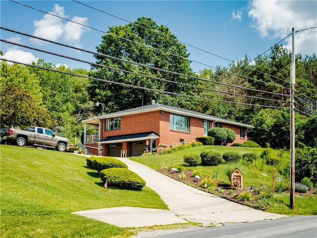 3015 Graham Ave, Windber, PA 15963 - view of front of home featuring an attached garage, a front yard, and brick siding