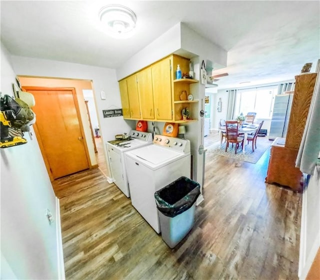 3015 Graham Ave, Windber, PA 15963 - laundry area featuring cabinet space, washing machine and dryer, and wood finished floors