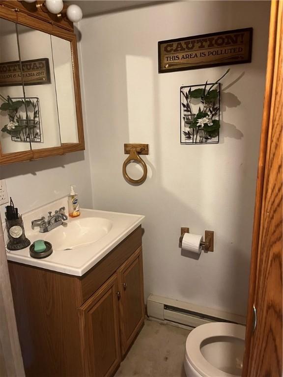 3015 Graham Ave, Windber, PA 15963 - half bath featuring vanity and baseboard heating