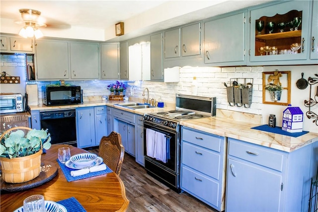 3015 Graham Ave, Windber, PA 15963 - kitchen with black appliances, backsplash, light countertops, and a ceiling fan