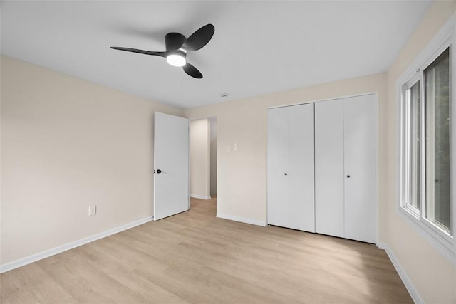 1014 Olga St, Ambridge, PA 15003 - unfurnished bedroom with light wood-style flooring, a closet, multiple windows, and ceiling fan
