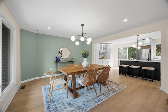 1014 Olga St, Ambridge, PA 15003 - dining space featuring light wood-style floors, a chandelier, and recessed lighting