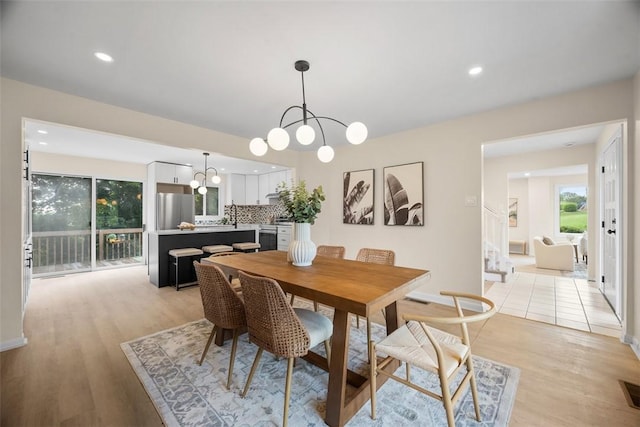 1014 Olga St, Ambridge, PA 15003 - dining room with light wood-style floors, a chandelier, and recessed lighting