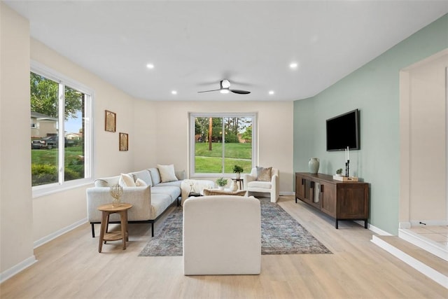 1014 Olga St, Ambridge, PA 15003 - living area with healthy amount of natural light, light wood finished floors, recessed lighting, and ceiling fan