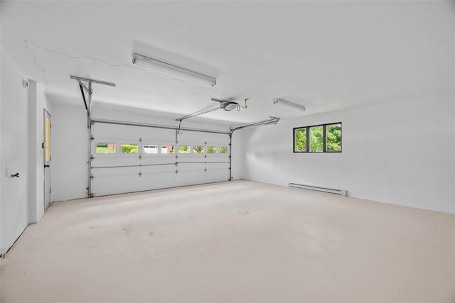 1014 Olga St, Ambridge, PA 15003 - garage featuring baseboard heating and a garage door opener