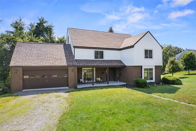 1014 Olga St, Ambridge, PA 15003 - view of front of house with driveway, brick siding, a garage, and a front yard