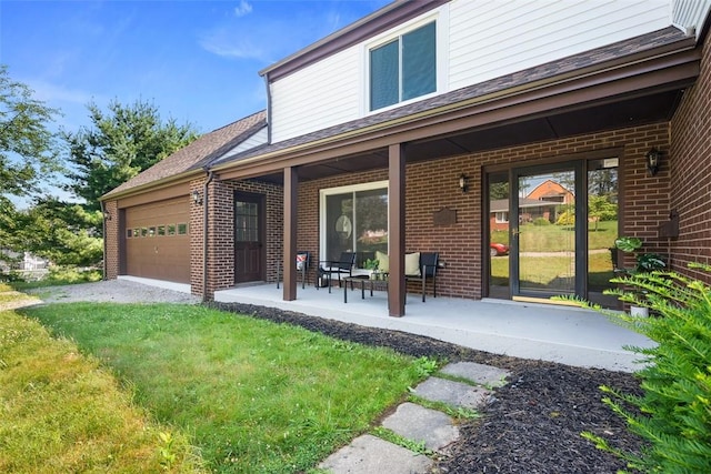 1014 Olga St, Ambridge, PA 15003 - back of property featuring brick siding, an attached garage, and a lawn