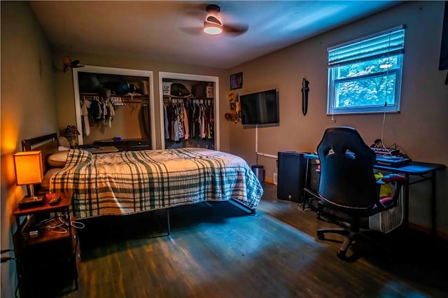 622 National Dr, Penn Hills, PA 15235 - bedroom with multiple closets, wood finished floors, an office area, and ceiling fan