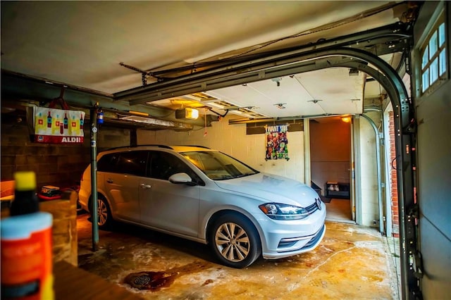 622 National Dr, Penn Hills, PA 15235 - garage with a garage door opener and concrete block wall