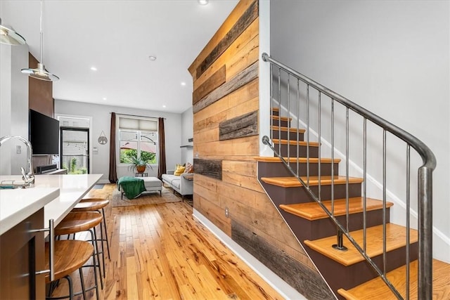 611 Suismon St, East Allegheny, PA 15212 - staircase featuring wood-type flooring and recessed lighting