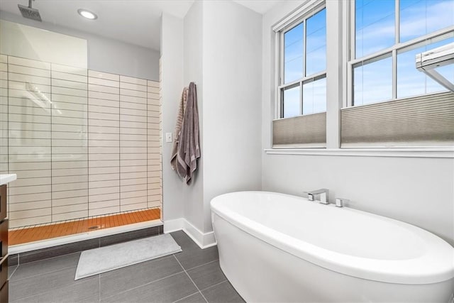 611 Suismon St, East Allegheny, PA 15212 - bathroom with a soaking tub, tile patterned flooring, a tile shower, recessed lighting, and vanity