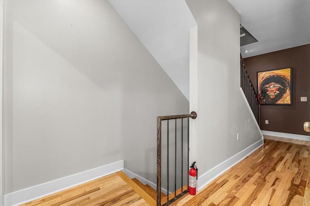 611 Suismon St, East Allegheny, PA 15212 - stairway with wood finished floors and baseboards
