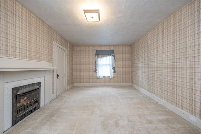860 W Ingomar Rd, Mccandless, PA 15237 - unfurnished living room featuring carpet, wallpapered walls, a fireplace, and a textured ceiling