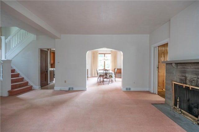 860 W Ingomar Rd, Mccandless, PA 15237 - carpeted living room featuring arched walkways, stairs, and a fireplace