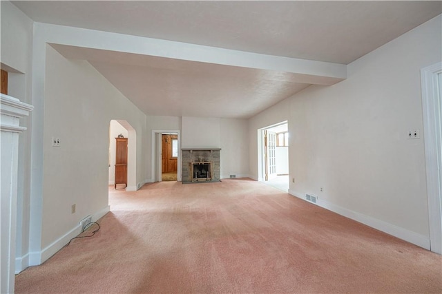 860 W Ingomar Rd, Mccandless, PA 15237 - unfurnished living room with light carpet, a fireplace with flush hearth, and arched walkways