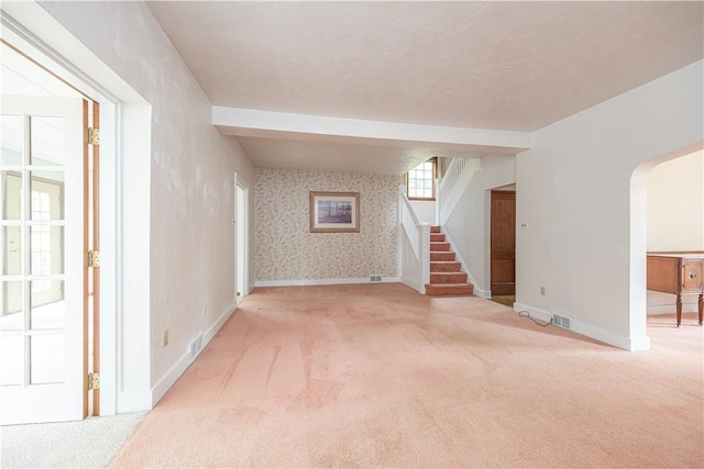 860 W Ingomar Rd, Mccandless, PA 15237 - carpeted spare room with stairs, arched walkways, and wallpapered walls