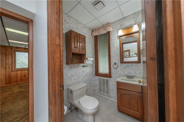 860 W Ingomar Rd, Mccandless, PA 15237 - half bathroom featuring vanity, wallpapered walls, and a drop ceiling