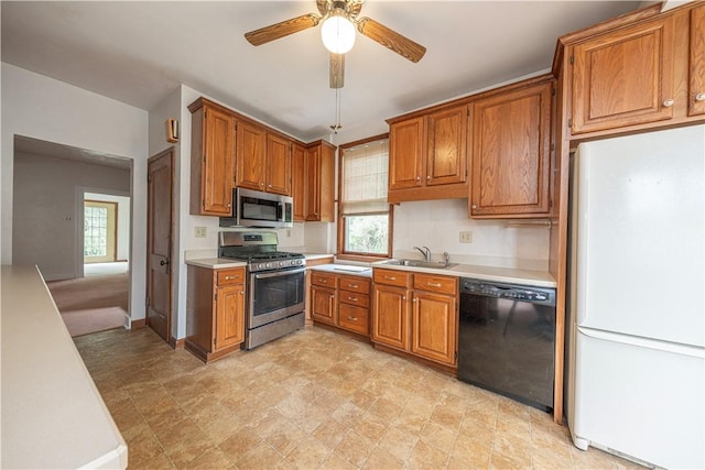 860 W Ingomar Rd, Mccandless, PA 15237 - kitchen with appliances with stainless steel finishes, light countertops, brown cabinetry, and plenty of natural light