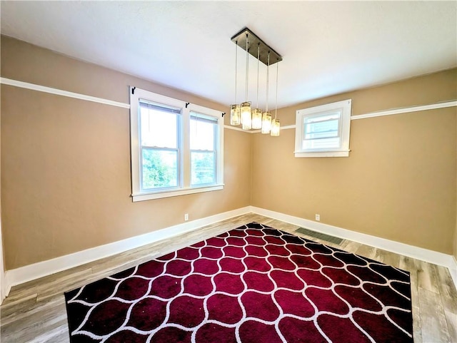 213 N 5th St, Jeannette, PA 15644 - spare room with baseboards and wood finished floors