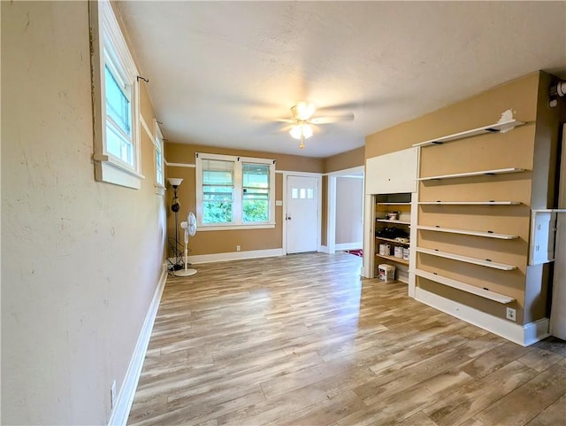 213 N 5th St, Jeannette, PA 15644 - unfurnished living room featuring light wood finished floors and a ceiling fan
