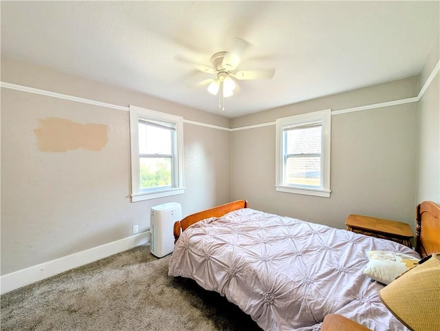 213 N 5th St, Jeannette, PA 15644 - carpeted bedroom featuring multiple windows and ceiling fan