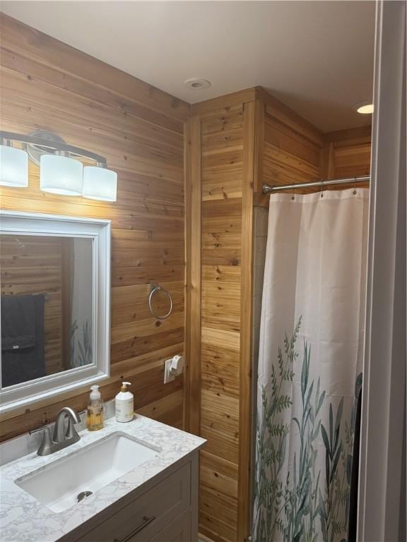 105 White Oak Dr, Twp Of But Se, PA 16001 - bathroom with vanity, curtained shower, and wood walls
