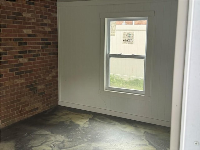 105 White Oak Dr, Twp Of But Se, PA 16001 - empty room featuring brick wall