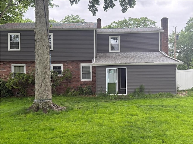 105 White Oak Dr, Twp Of But Se, PA 16001 - rear view of property with a lawn, a chimney, and brick siding