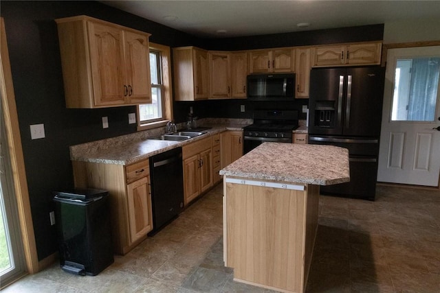 2681 Mallory Rd, Pa, PA 16314 - kitchen with black appliances, light brown cabinetry, light countertops, and a kitchen island