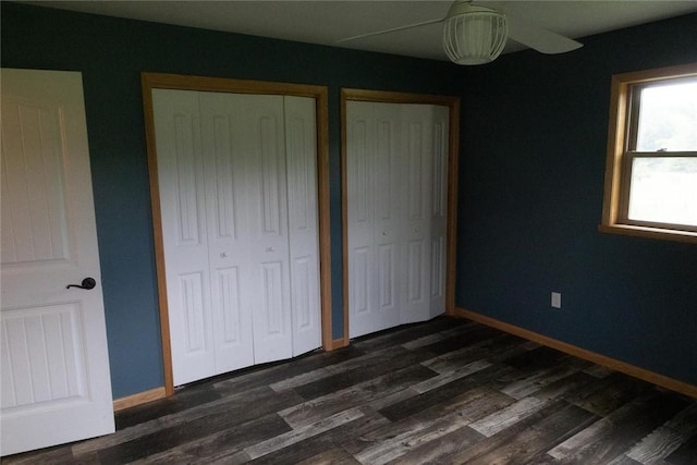 2681 Mallory Rd, Pa, PA 16314 - unfurnished bedroom with two closets, dark wood-style floors, and a ceiling fan
