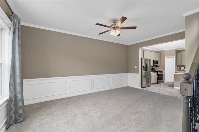 1103 Deerfield Dr, Franklin Park, PA 15143 - unfurnished room featuring ceiling fan, light colored carpet, ornamental molding, a wainscoted wall, and a decorative wall