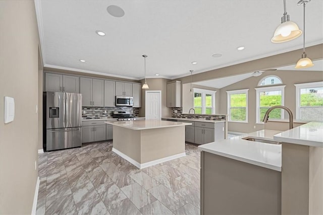 1103 Deerfield Dr, Franklin Park, PA 15143 - kitchen with appliances with stainless steel finishes, gray cabinets, a kitchen island with sink, crown molding, and tasteful backsplash