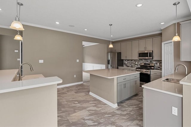 1103 Deerfield Dr, Franklin Park, PA 15143 - kitchen with stainless steel appliances, gray cabinetry, a kitchen island, crown molding, and recessed lighting