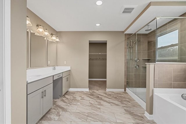 1103 Deerfield Dr, Franklin Park, PA 15143 - bathroom with a stall shower, double vanity, a garden tub, a walk in closet, and marble finish floors
