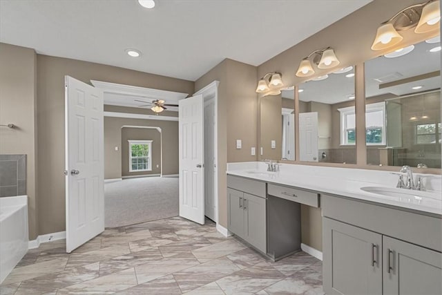 1103 Deerfield Dr, Franklin Park, PA 15143 - bathroom featuring double vanity, a garden tub, ceiling fan, a shower stall, and marble finish floors