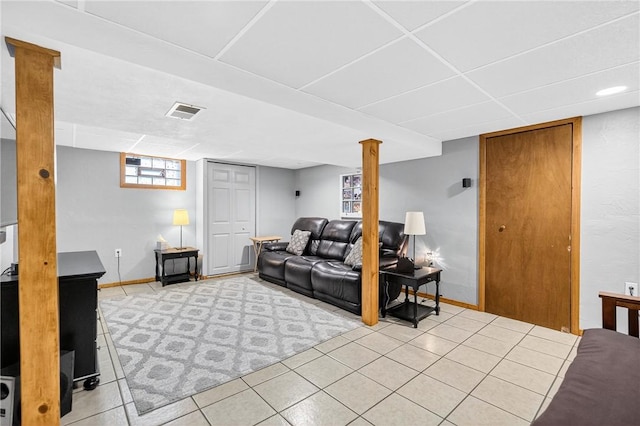 915 Summit St, Mckeesport, PA 15132 - living room featuring baseboards and light tile patterned floors